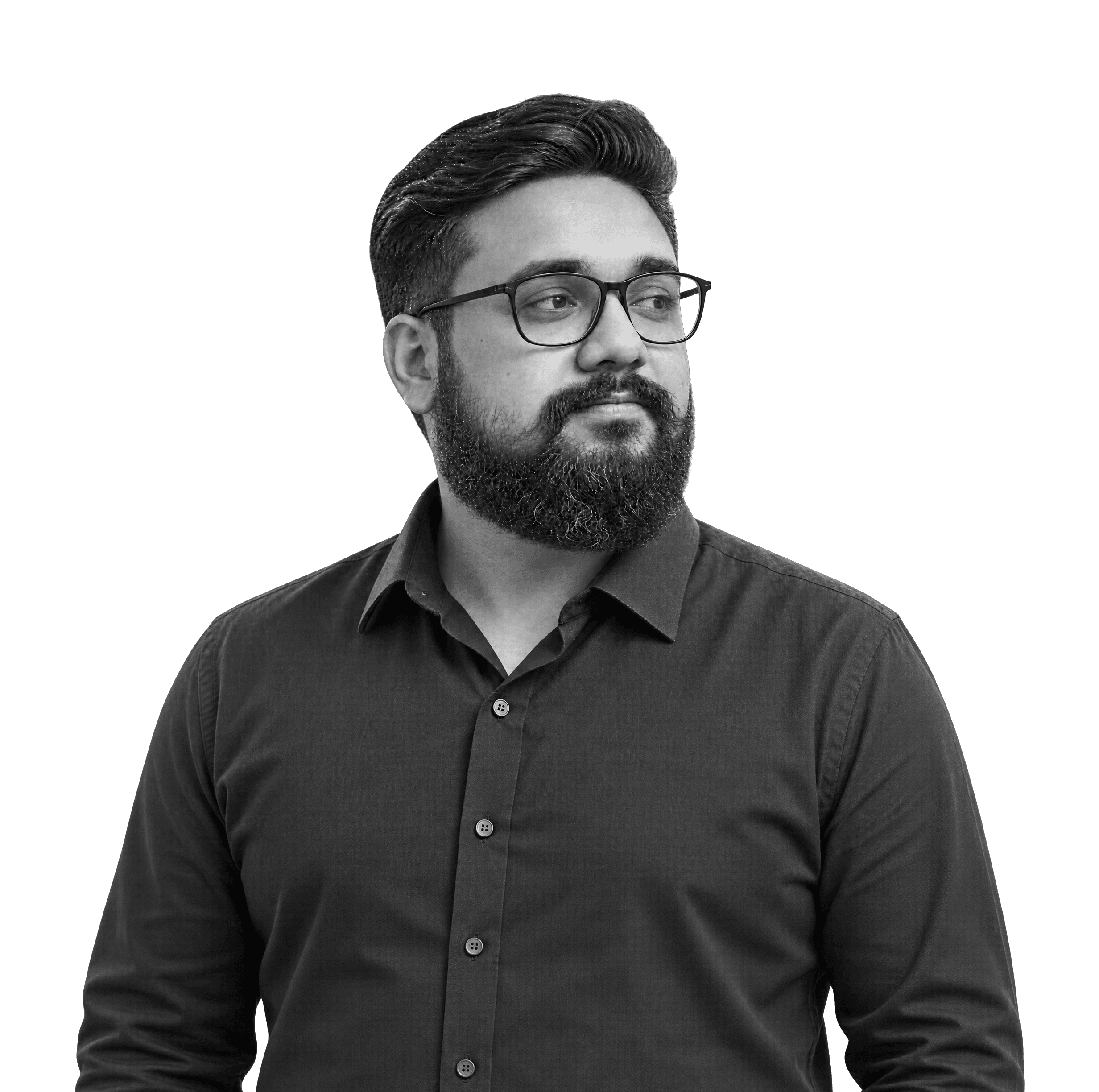 Muhammad Waqas, head and shoulders, in black and white, with glasses, a beard and a dark collared shirt, looking to one side.